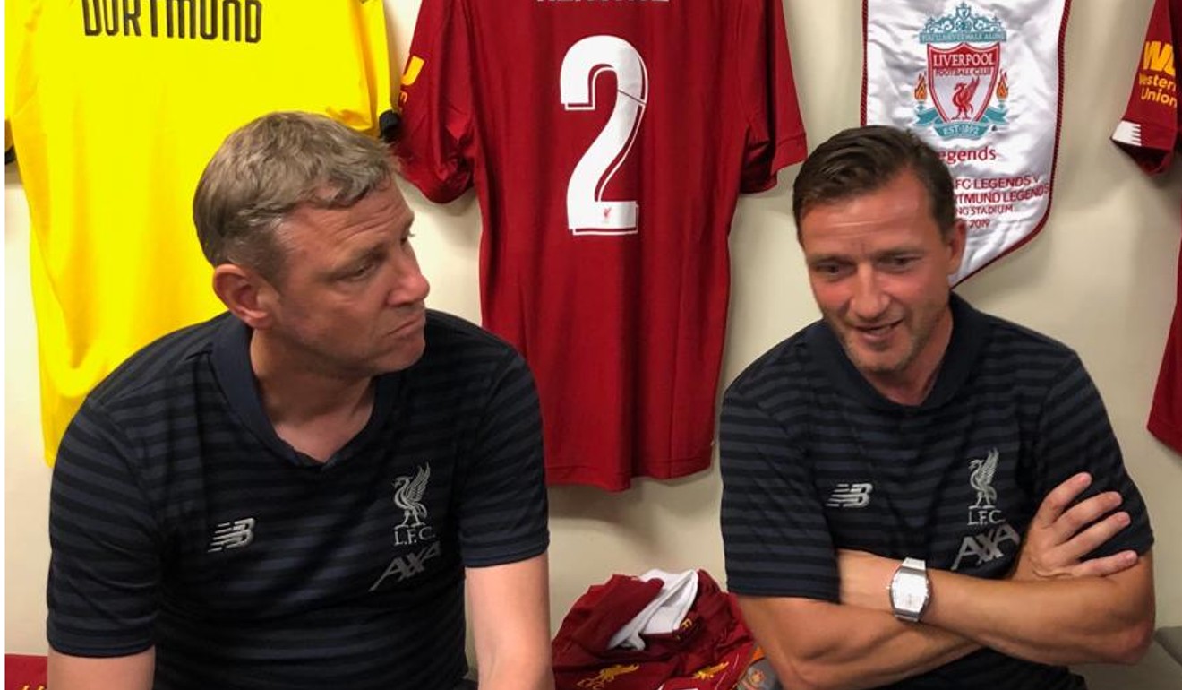 Stephane Henchoz and Vladimir Smicer discuss strategy before their match against Borussia Dortmund Legends Saturday at Hong Kong Stadium. Photo: Handout