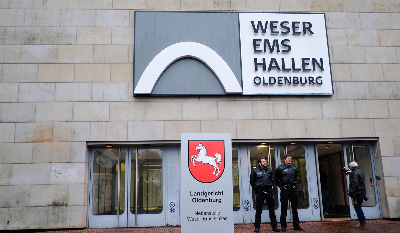 Police officers stand in front of the Weser-Ems-Hallen building in Oldenburg, where one of Hoegel’s trials took place. Photo: AFP