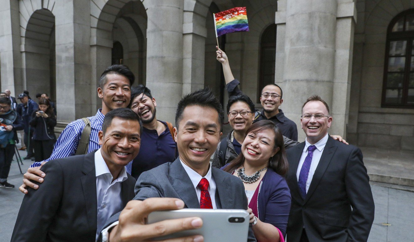 The couple take a selfie with their supporters outside the Court of Final Appeal after the first day of the hearing in May. Photo: Nora Tam