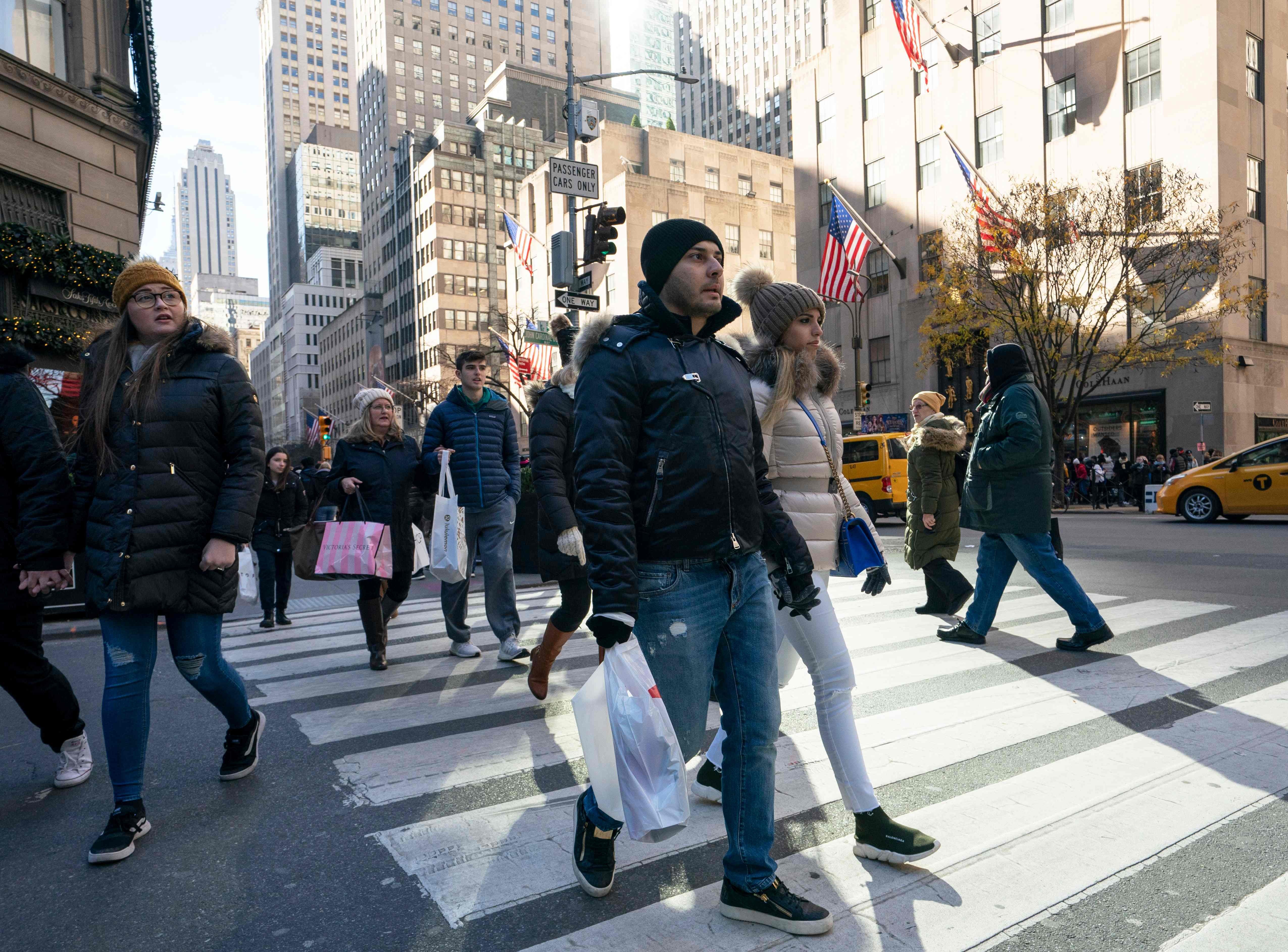 Shoppers in the US are discovering better deals thanks to low global interest rates, yet inflation still looks like a distant problem. Photo: AFP