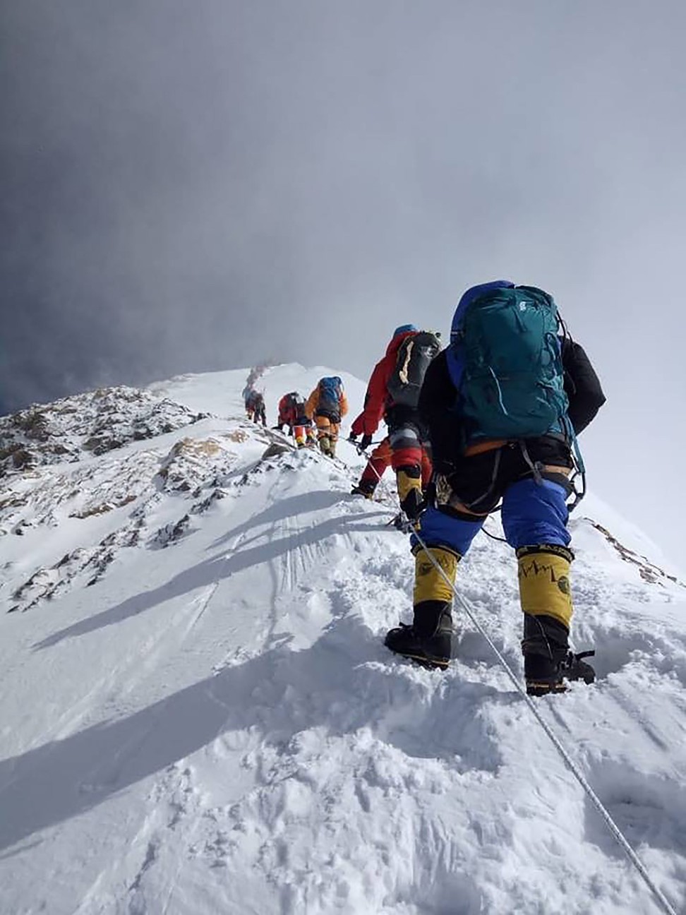 Climbers join the line en route to the summit. Photo: AFP
