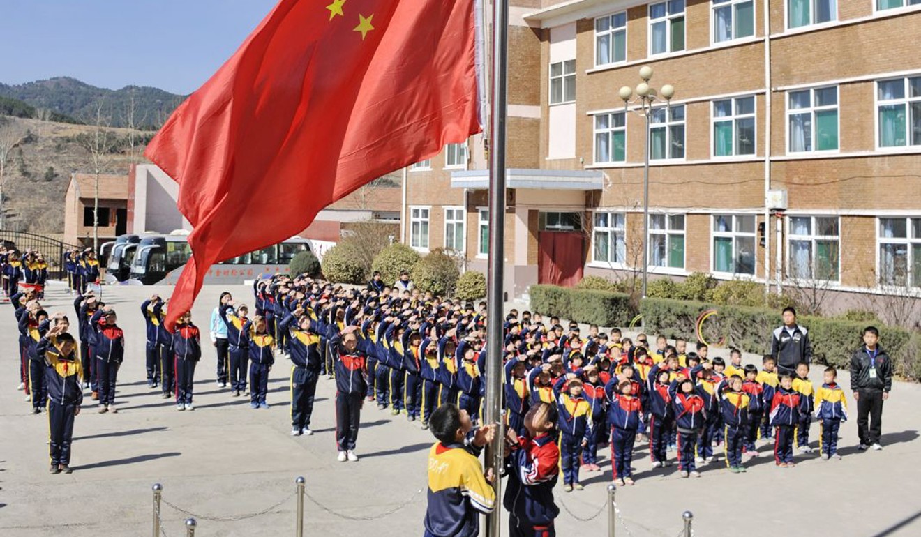A flag-raising ceremony at Bo Ai School in Fengcun village, Shanxi province. Photo: Handout