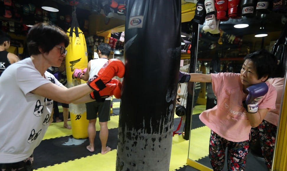 Parkinson’s patients Fung Po-shim and Apple Wong learning Muay Thai at the Fu Tak Gymnasium. Photo: Xiaomei Chen