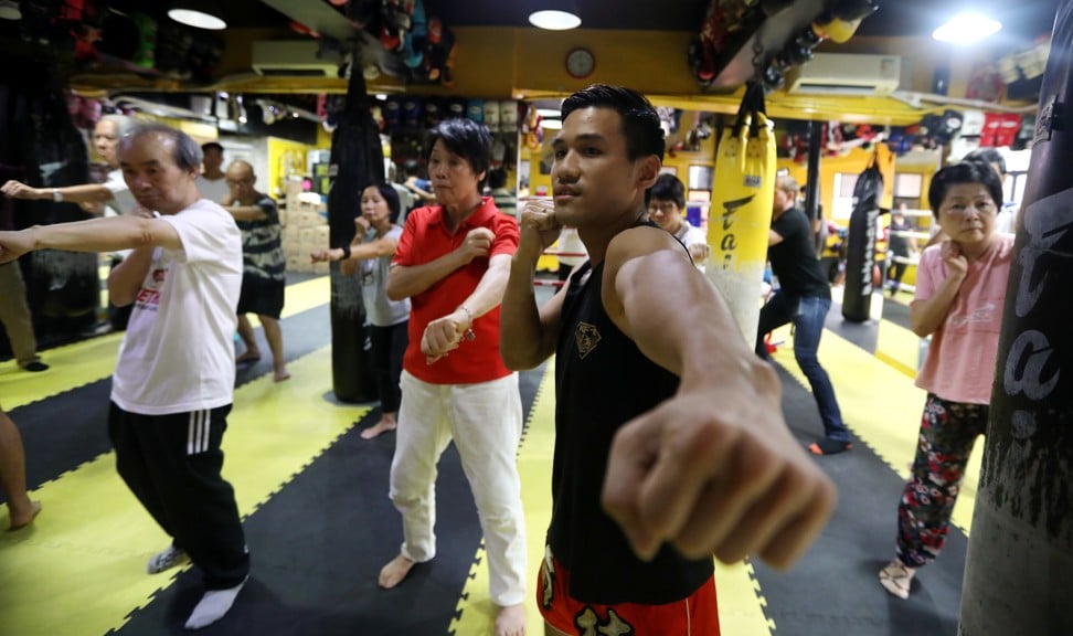 Coach Chan Kai-tik teaching Parkinson’s patients Muay Thai. Photo: Xiaomei Chen