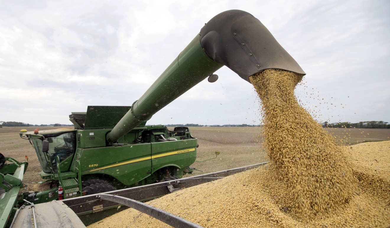 Soybeans are loaded off a combine in Brownsburg, Indiana, in the US Midwest. Beijing has aimed retaliatory duties specifically at US producers of soybeans and other products in a direct shot at Trump supporters. Photo: AP