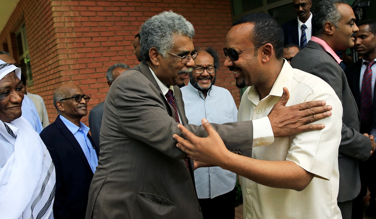 Ethiopian Prime Minister Abiy Ahmed (R) meets members of Sudan's opposition alliance in Khartoum. Photo: Reuters