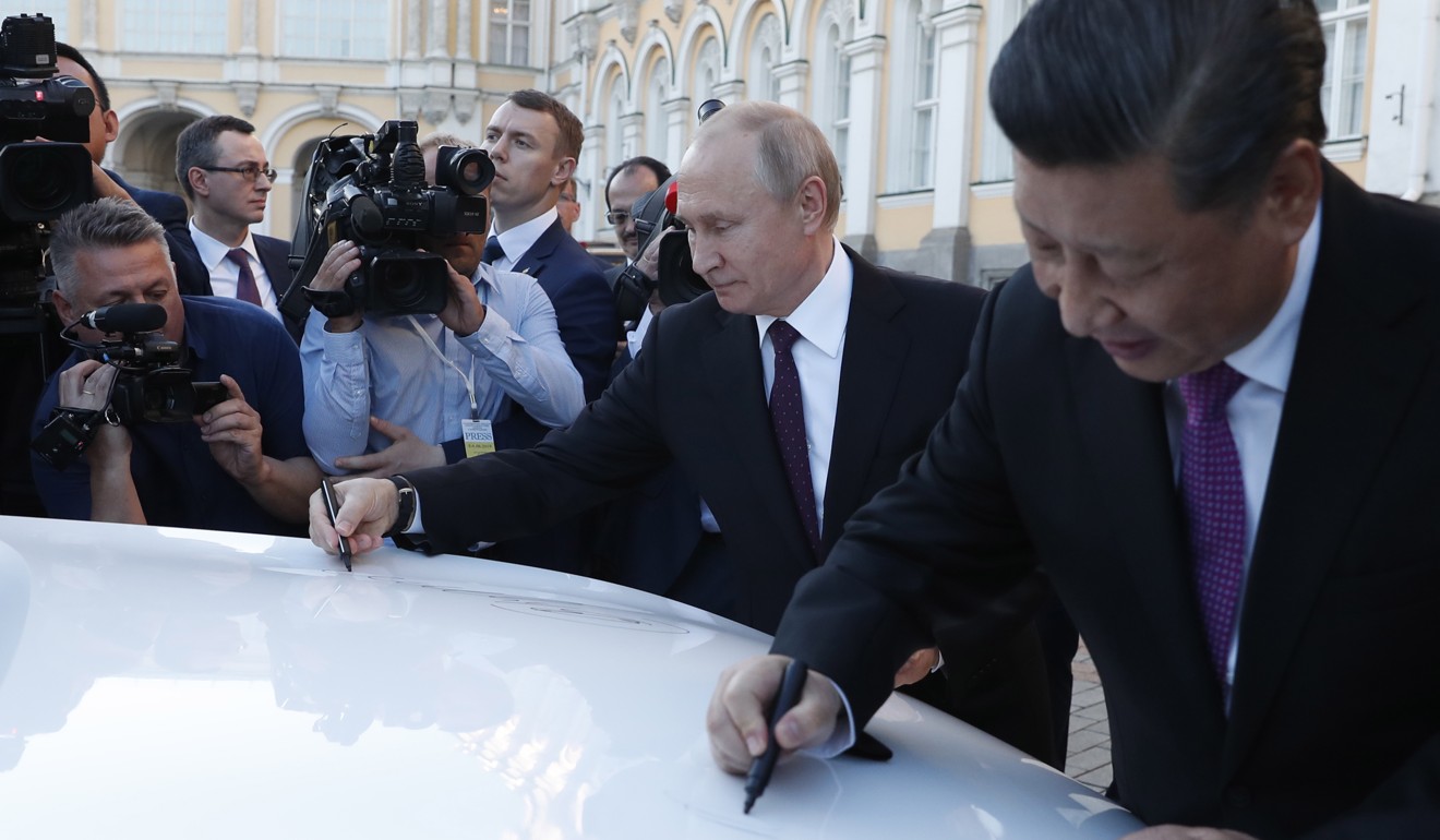During Xi’s visit to Russia, representatives from the two countries signed deals in several fields, including cars. Photo: EPA-EFE