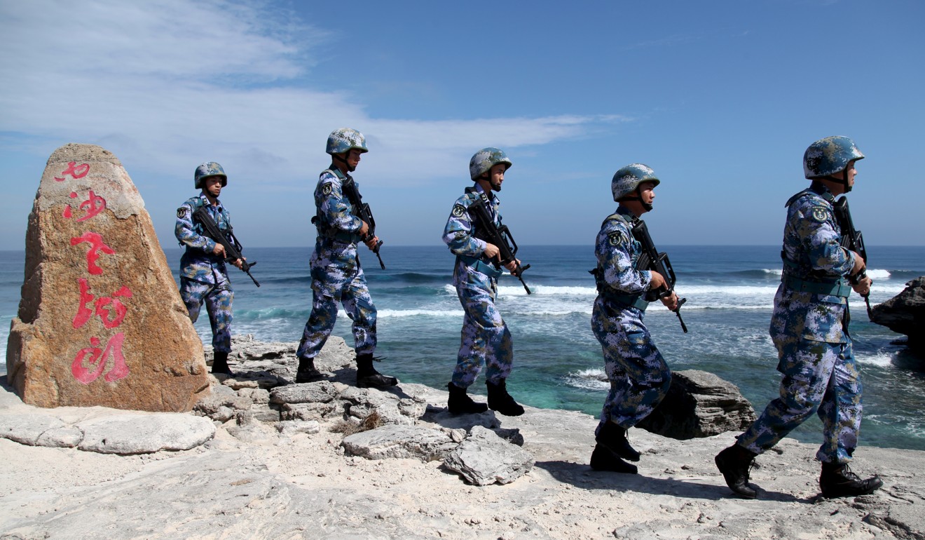 Chinese naval troops patrol on Woody Island in the Paracel group. Photo: Reuters