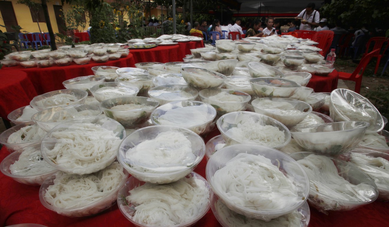 Bowls of noodles are placed at a Buddhist pagoda for garment workers outside Phnom Penh. Photo: AP