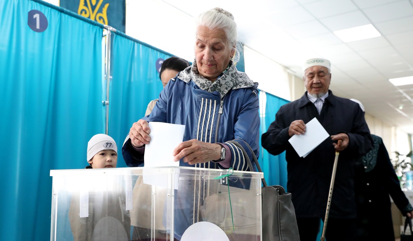 A Kazakh woman casts her vote in Nur-Sultan on Sunday. Photo: EPA