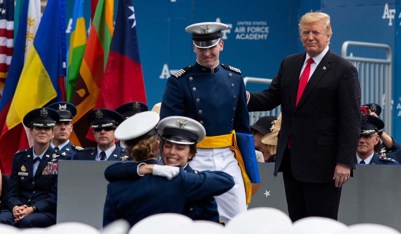 US President Donald Trump congratulates graduates, with Taiwan’s flag among those in the background, during a ceremony at the US Air Force Academy on May 30. Photo: AFP