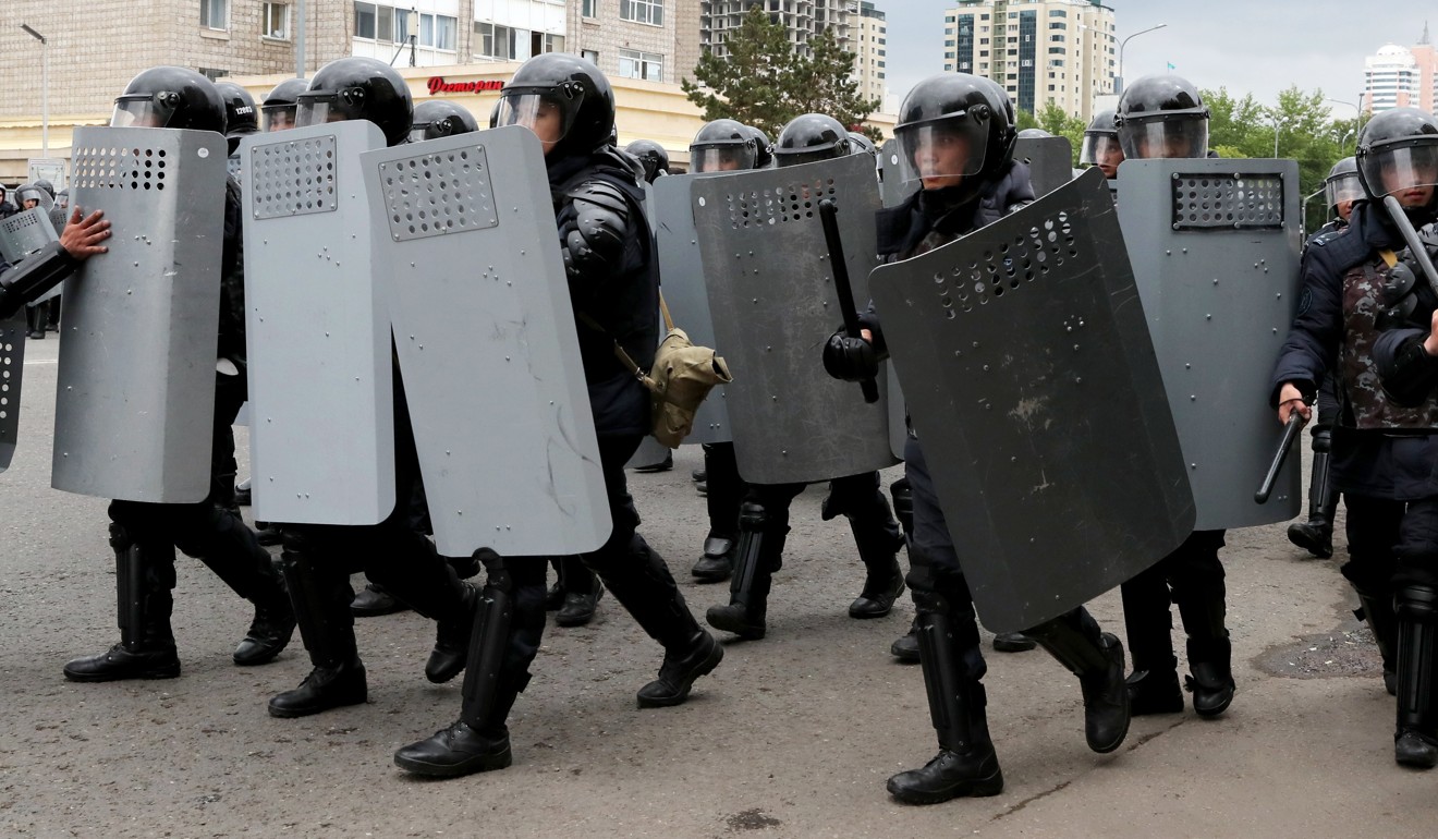Officers, some in riot gear with shields and helmets, broke up the demonstrations in the capital, Nur-Sultan, and in Almaty. Photo: EPA