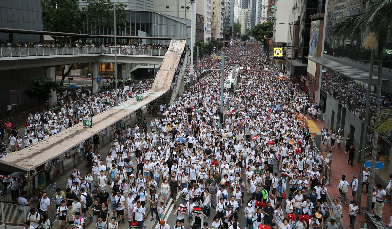 The streets were awash with white, the colour organisers asked protesters to wear. Photo: Winson Wong
