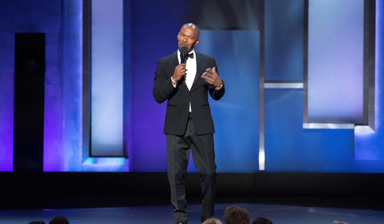 Jamie Fox pays tribute to Denzel Washington at last Thursday’s 47th AFI Life Achievement Award gala. Photo: Reuters