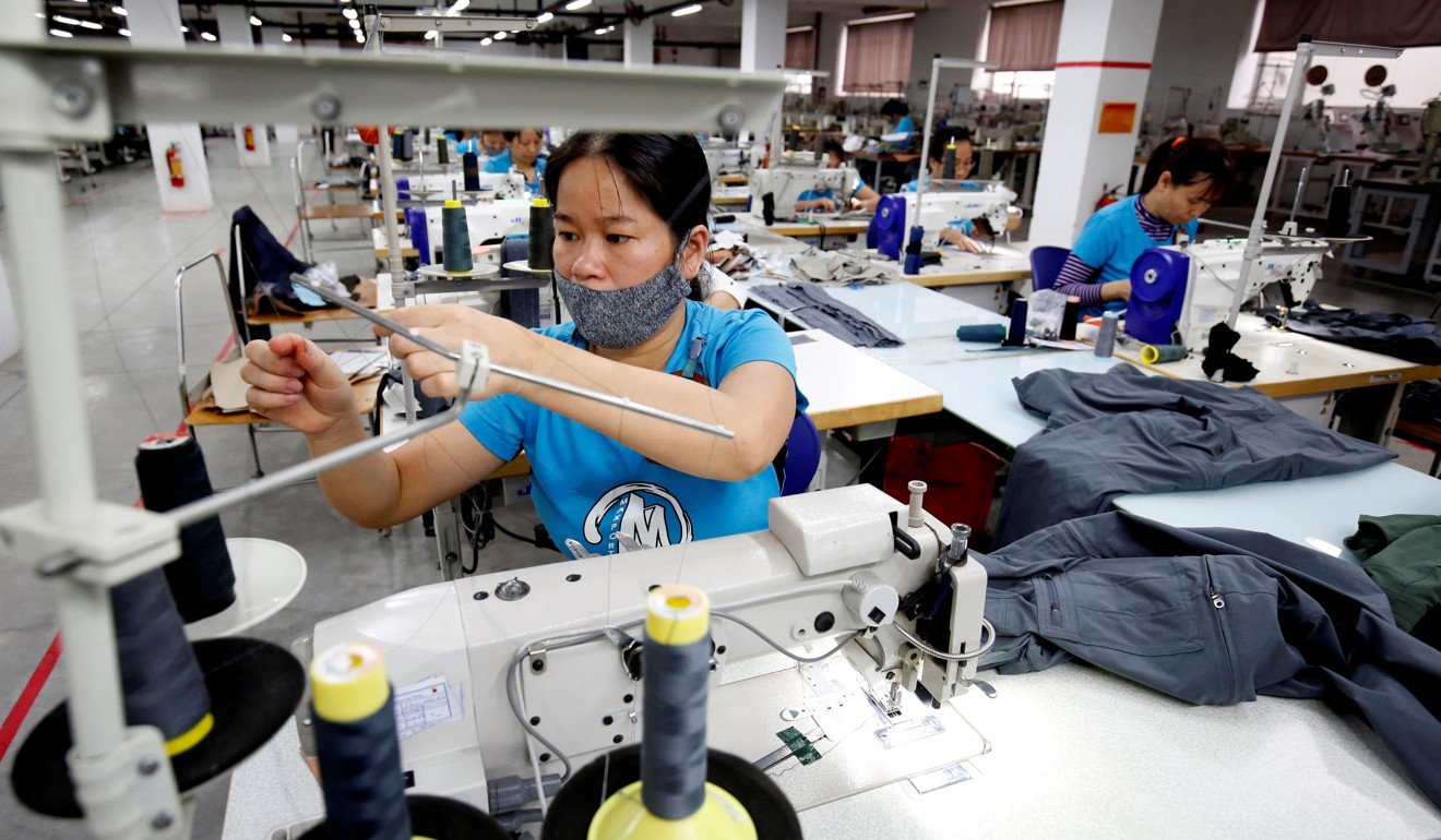 Labourers work at an export garment factory in Hanoi, Vietnam, on March 20. To meet the growing demand, Vietnam needs 96,500 megawatts of electricity by 2025. Photo: Reuters