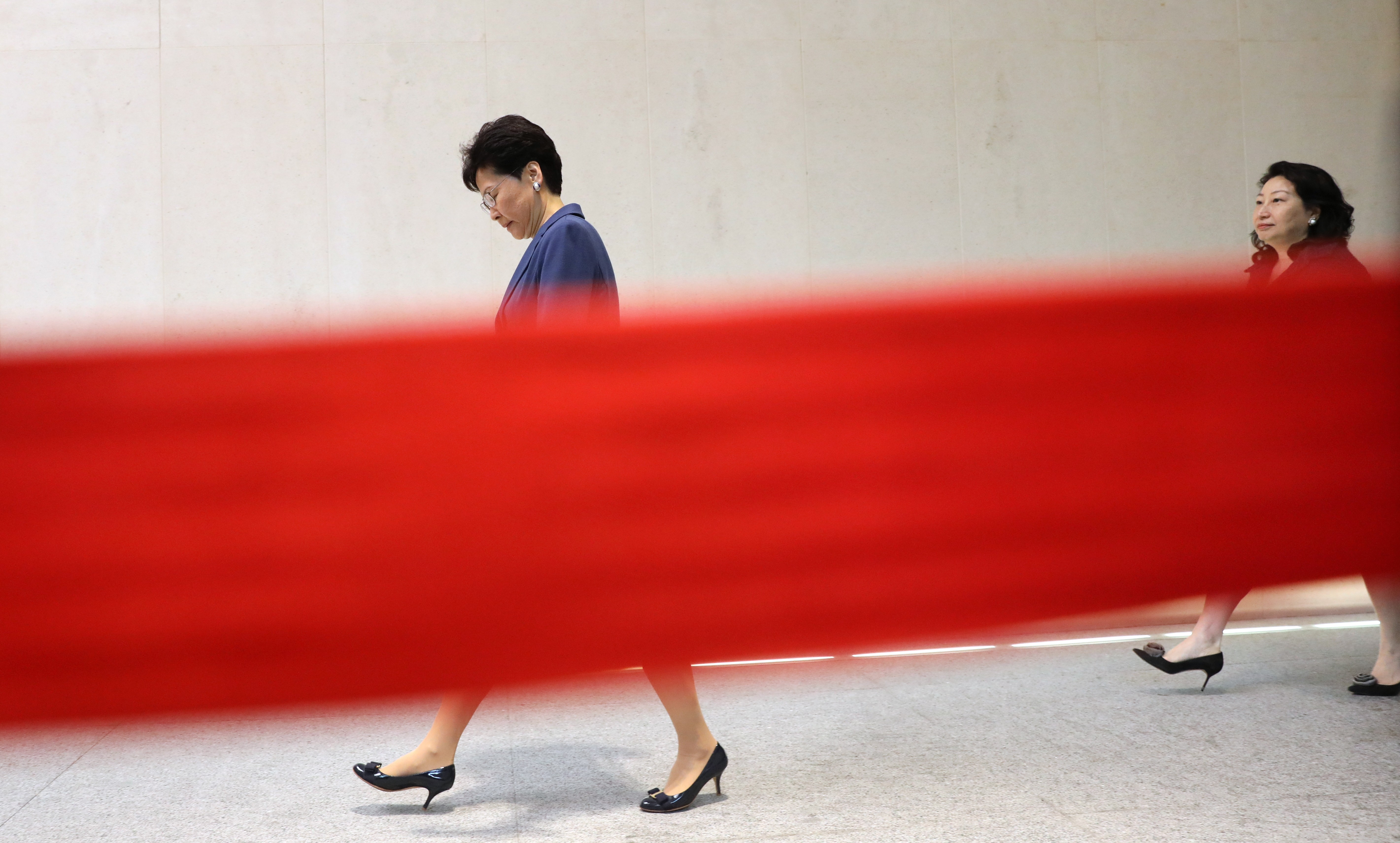 Hong Kong Chief Executive Carrie Lam and Secretary for Justice Teresa Cheng on their way to a media briefing a day after a massive protest against the extradition bill on Sunday. Photo: Sam Tsang