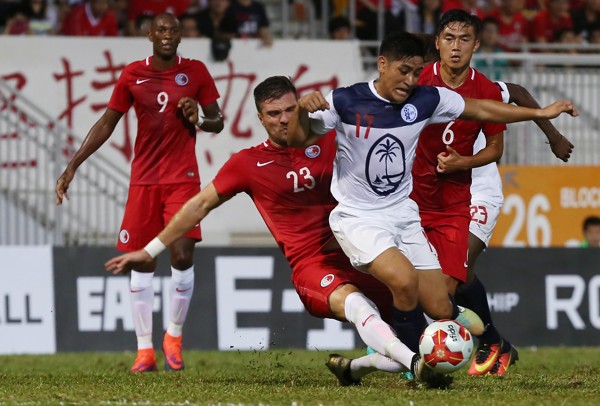 Andy Russell (23) tackles Guam’s Ian Mariano during the EAFF East Asian Football Cup at Mong Kok Stadium in 2016. Photo: Jonathan Wong