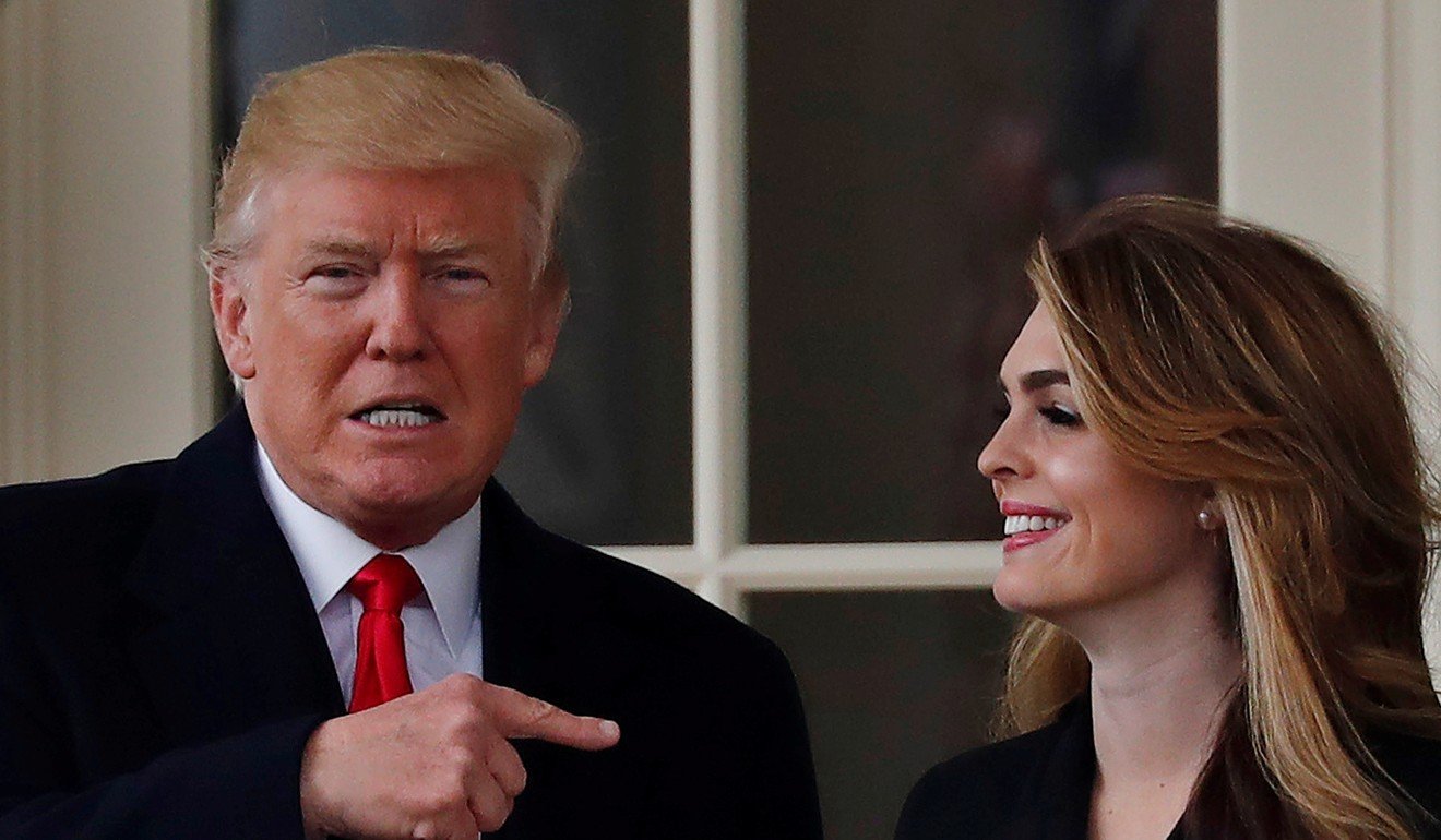 US President Donald Trump stands next to former White House communications director Hope Hicks outside the Oval Office in March 2018. Photo: Reuters