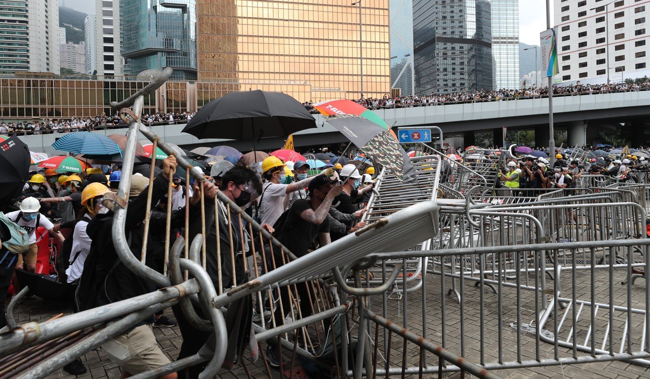 Demonstrators built barricades to separate themselves from police officers. Photo: Sam Tsang