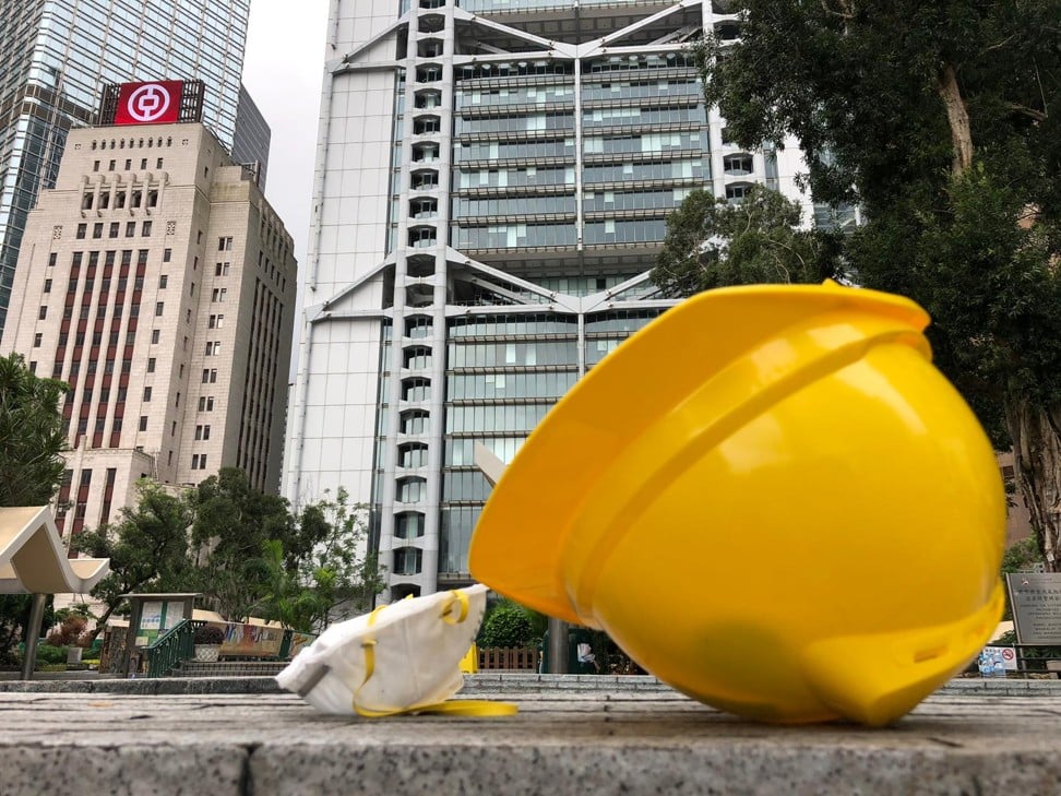A helmet and mask lay abandoned in Statue Square, Central. Photo: Robert Ng