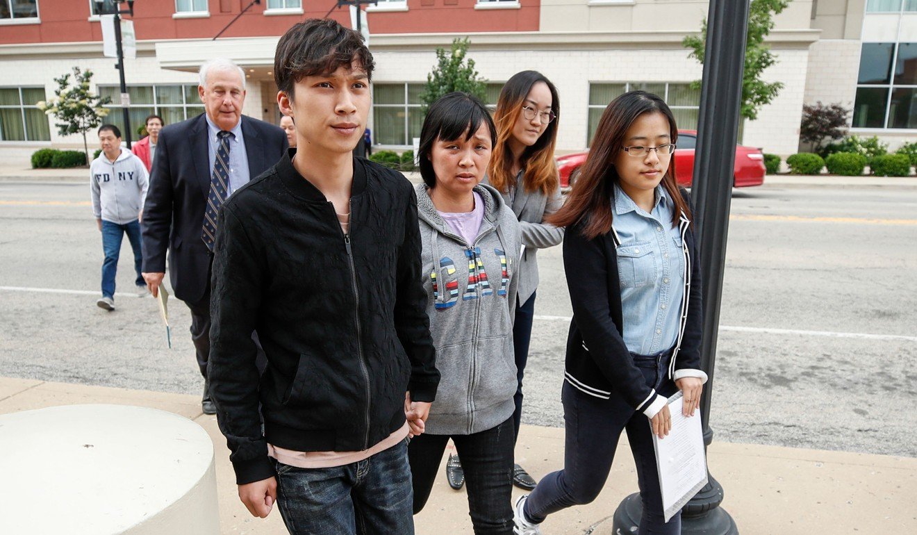 Zhang Yingying’s mother, Ye Lifeng (front centre), and brother Zhang Zhengyang (front left) arrive at the courthouse on Wednesday. Photo: AFP