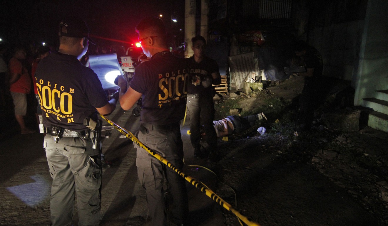 The body of an unknown victim shot and killed by unknown assailants in Caloocan City, Philippines, on July 14, 2018. Photo: Vincent Go