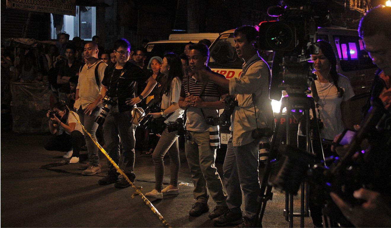The “Night Crawlers of Manila”, a group of reporters who cover unexplained killings in the Philippine capital. Photo: Vincent Go