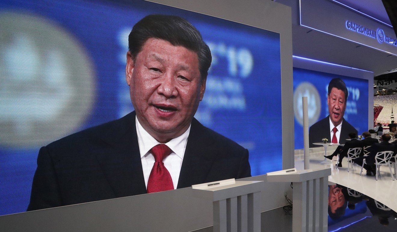 Screens show Chinese President Xi Jinping speaking at an international economic forum in St. Petersburg, Russia on June 7. Xi has called for the construction of an “innovation-driven economy” to make China a global innovation leader by 2035. Photo: EPA-EFE