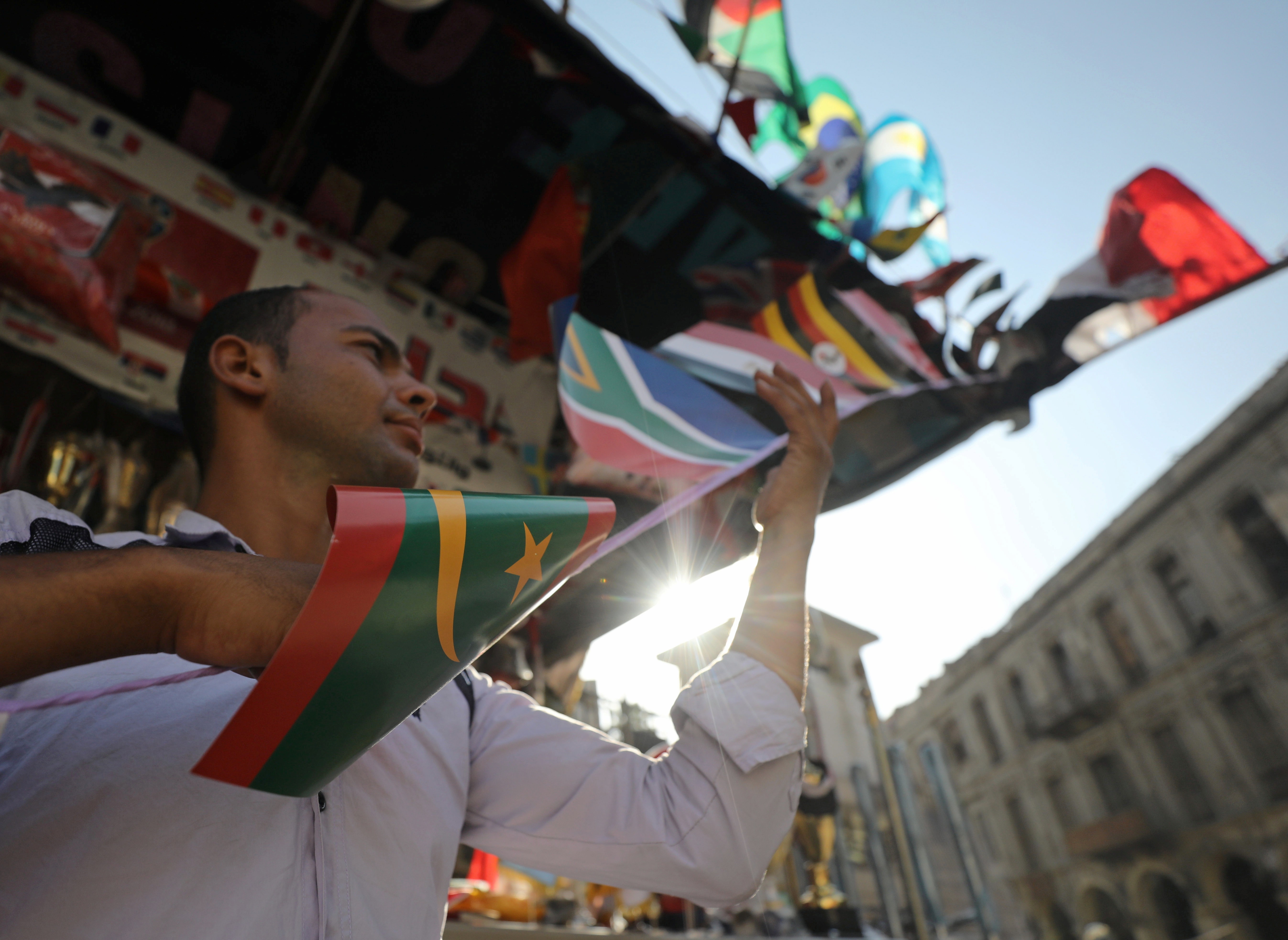 A man sells flags of African countries in Cairo ahead of the Africa Cup of Nations. Photo: Reuters