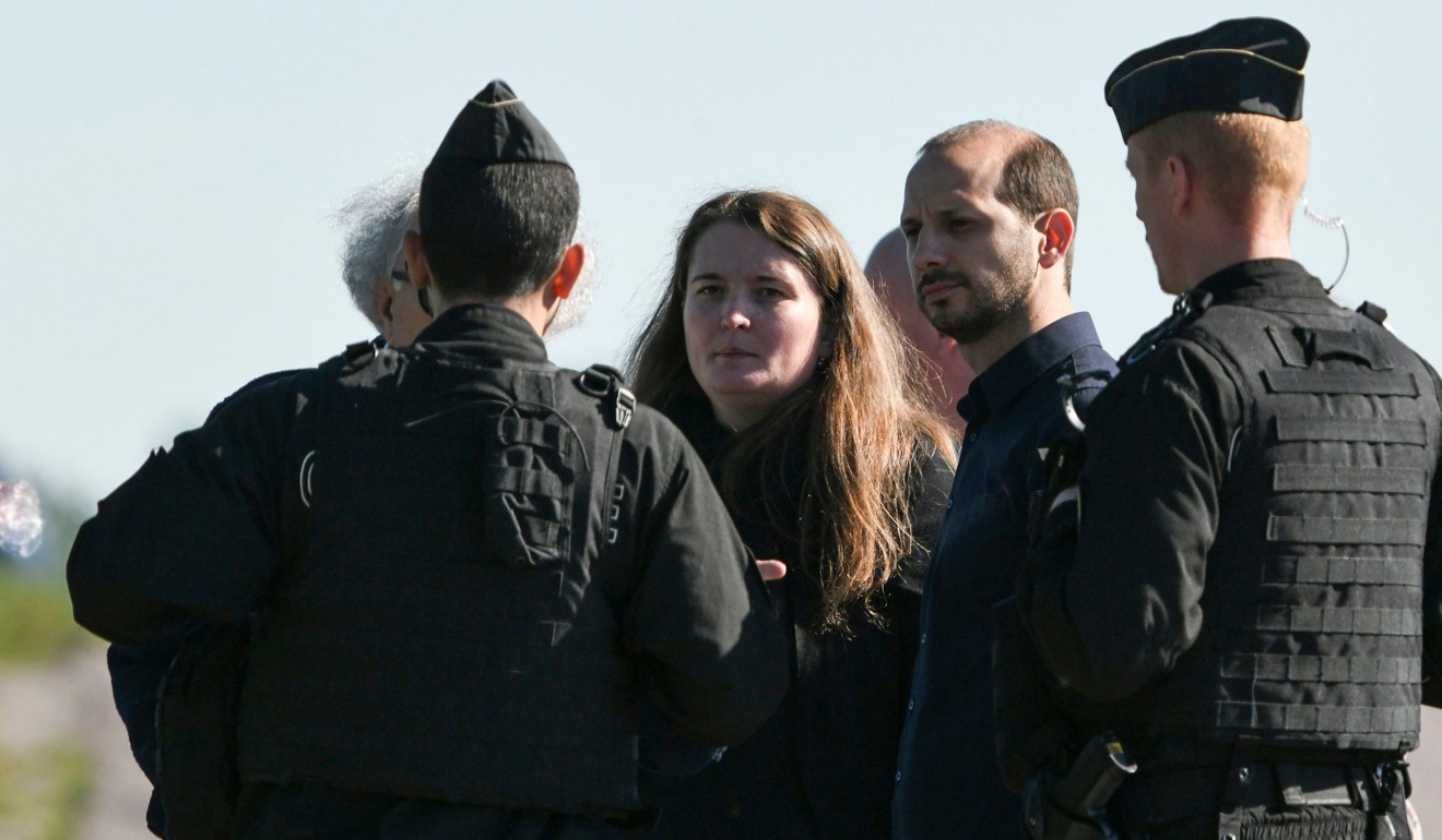 Alexia’s sister Stephanie and step-brother Gregory with police officers during the re-enactment on Monday. Photo: AFP