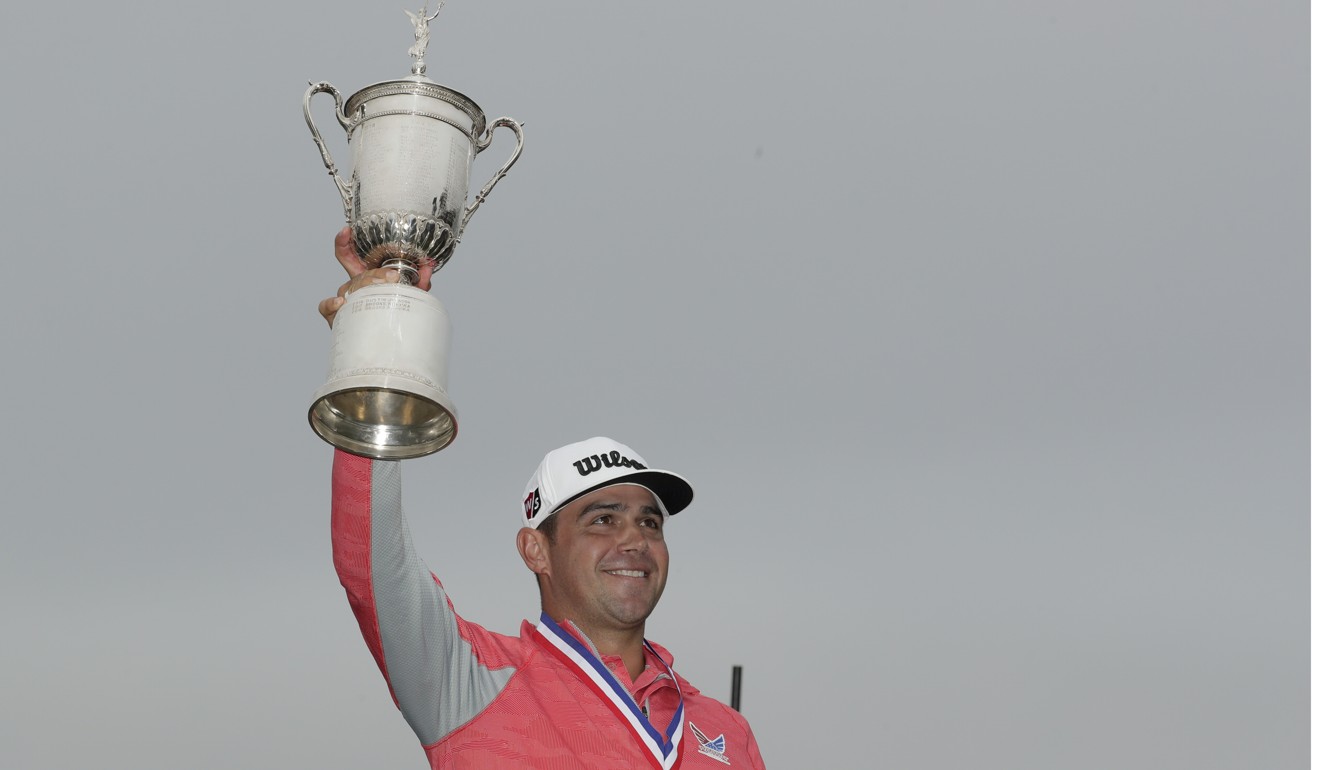 Gary Woodland celebrates with the trophy after winning the US Open. Photo: AP