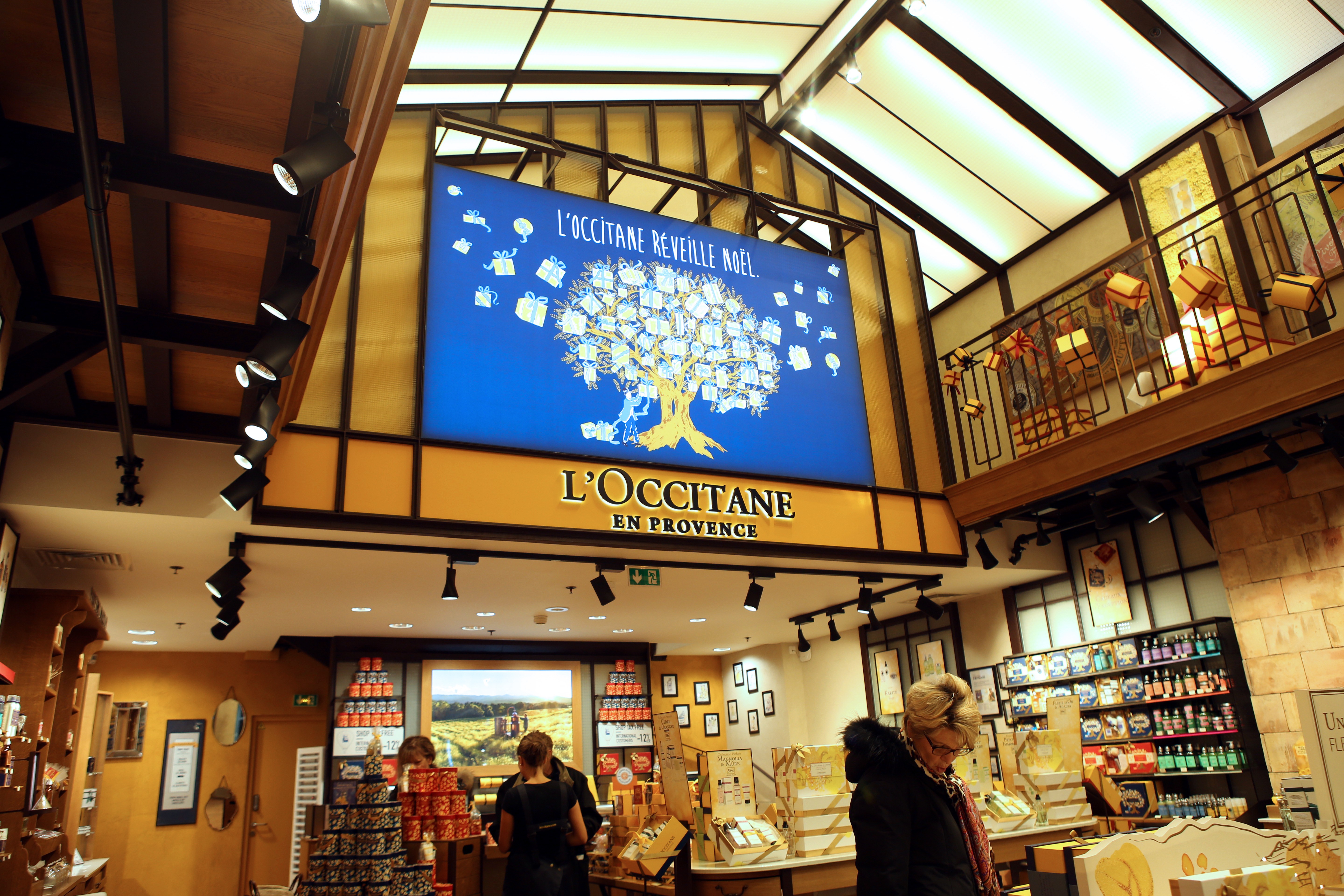 Customers shop at a L’Occitane store in Paris. The company sales in France were hurt because of protests last year. Photo: AFP
