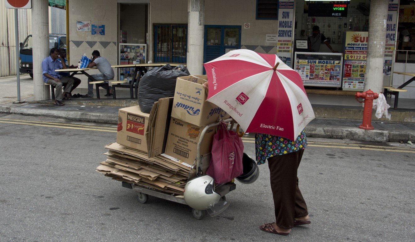 People on low incomes in Singapore often collect cardboard to make extra money. Photo: Julio Etchart