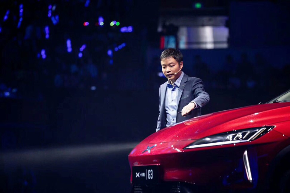 Xpeng Motor’s chairman He Xiaopeng with the all-electric Xpeng G3 SUV on March 7, 2019., Photo: SCMP