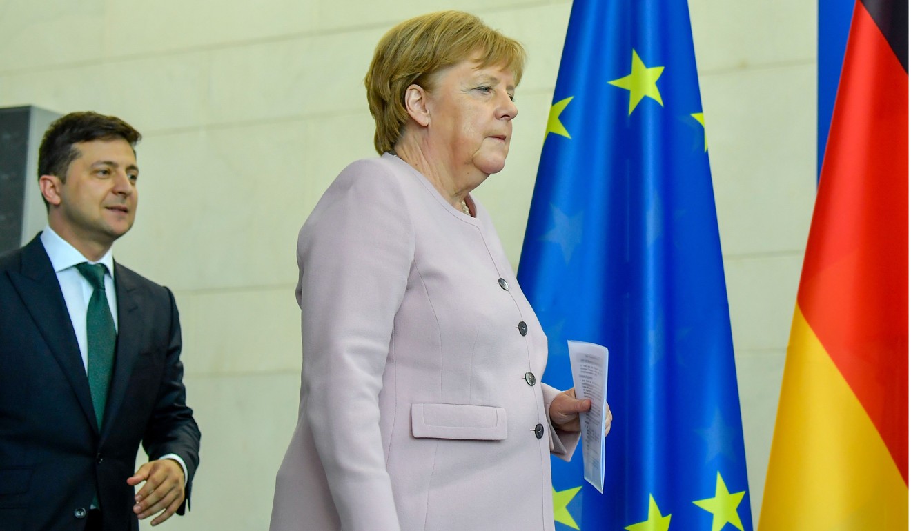 Merkel and Zelensky arriving at the press conference. Photo: AFP