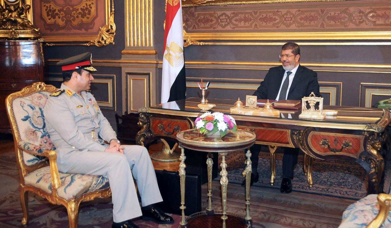 Egypt President Mohammed Mursi and Defence Minister General Abdel Fattah al-Sisi, who is now president, in 2012. File photo: AFP