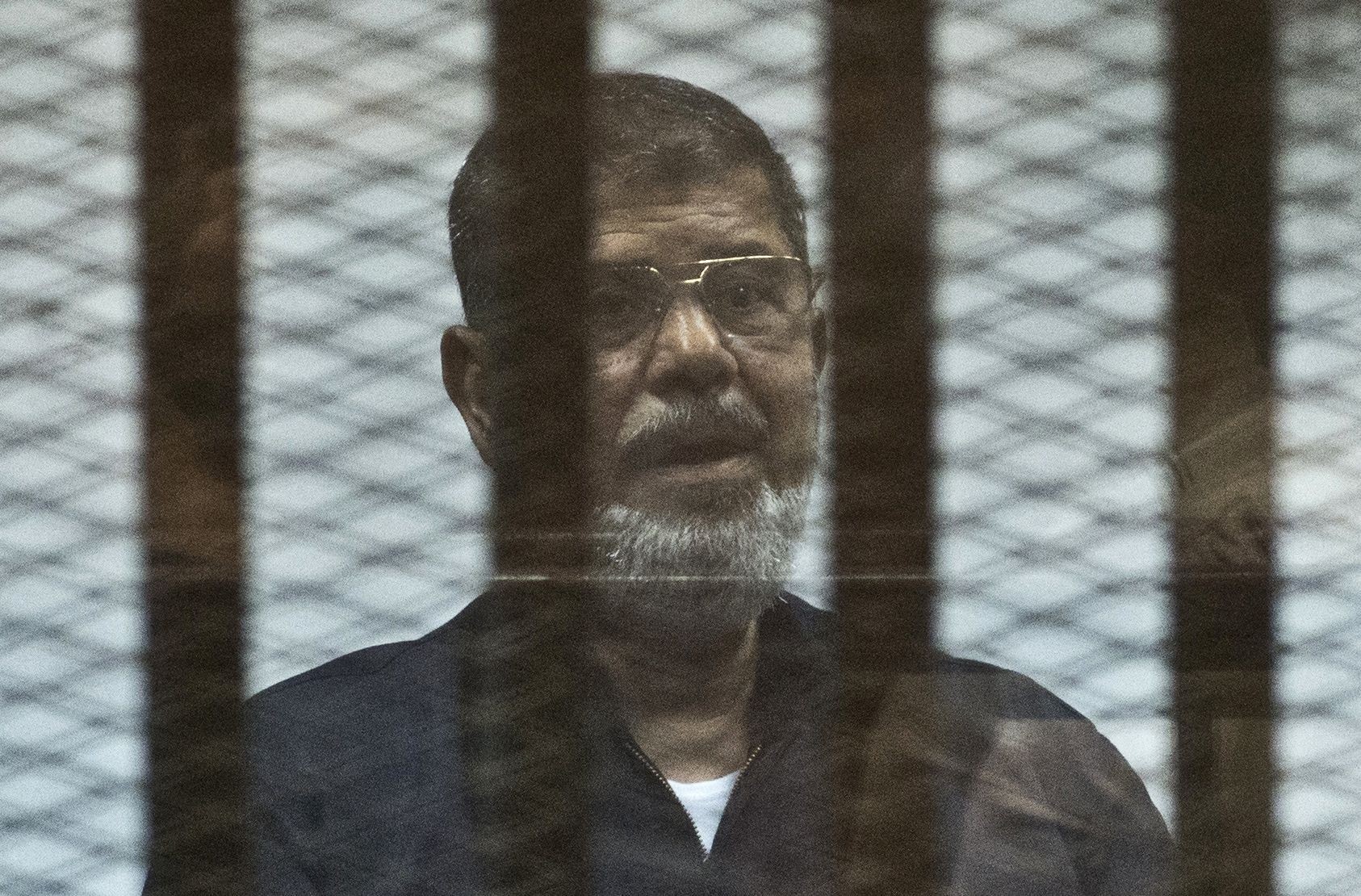 Egypt's ousted president Mohammed Mursi behind bars during a trial in 2015. File photo: AFP