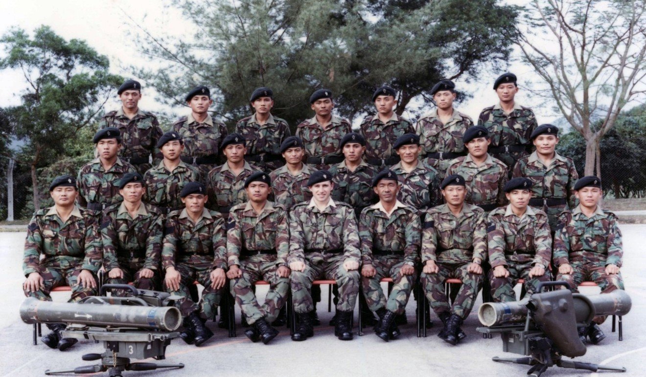 Hayes (centre) with Gurkhas in Hong Kong in 1990.