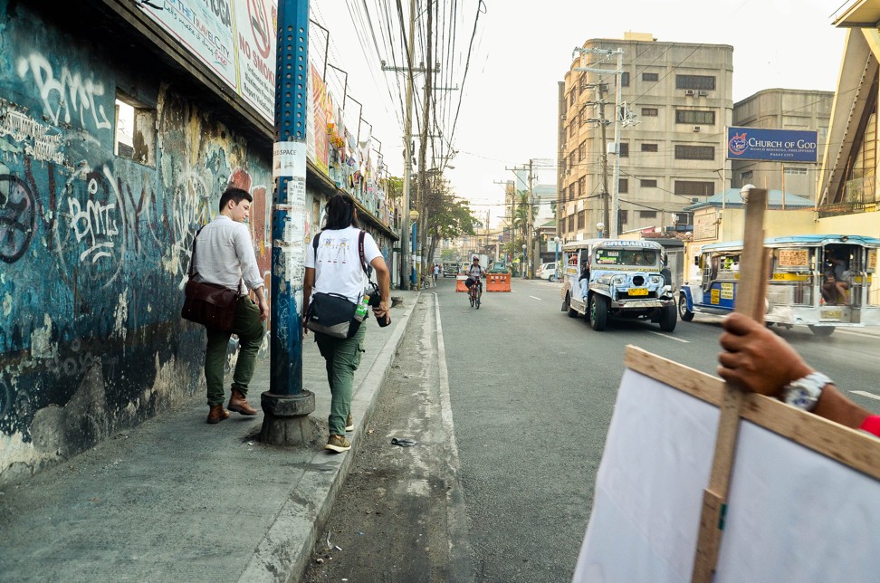 Tiu and his friend Hodder, casually tour the city, looking for interesting scenes to shoot on camera. Photo: Maro Enriquez