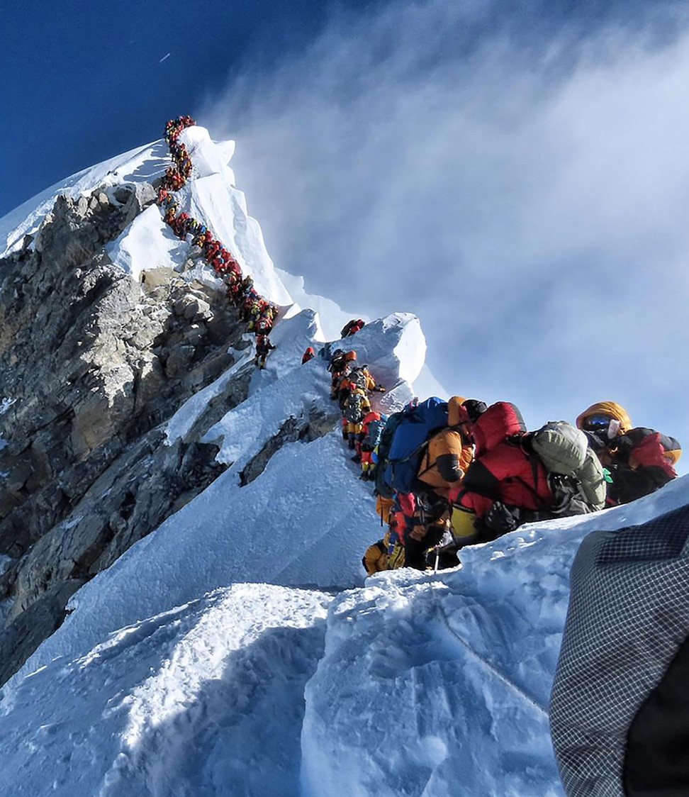 A traffic jam as climbers block the route to and from the summit of Everest on May 22. Photo AFP / Project Possible