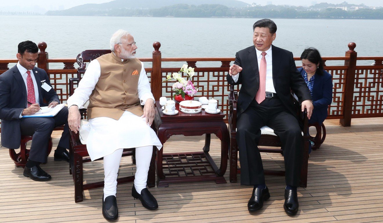 Indian Prime Minister Narendra Modi speaks with Chinese President Xi Jinping in Wuhan. Photo: Xinhua
