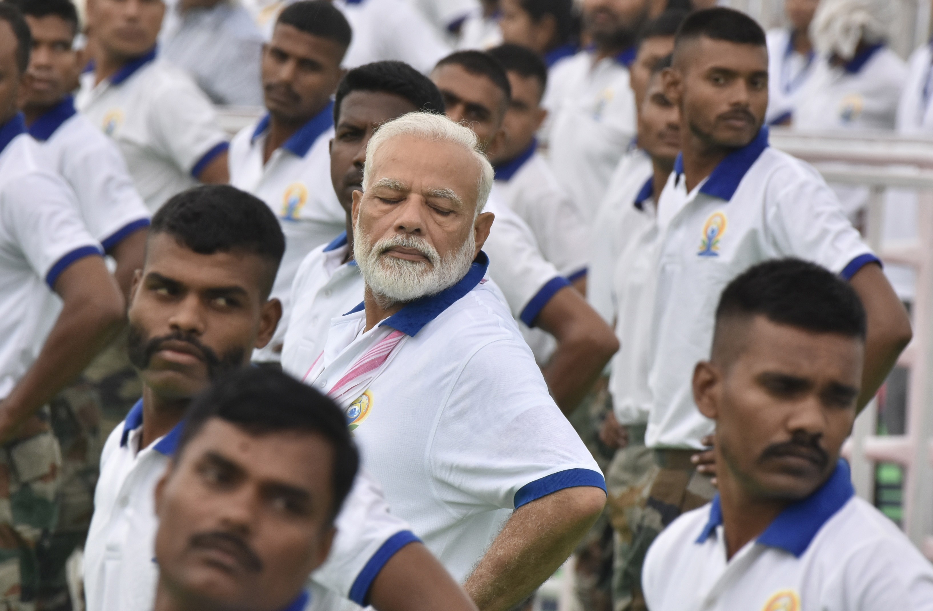Indian Prime Minister Narendra Modi (C) performs yoga in Ranchi. Photo: EPA-EFE