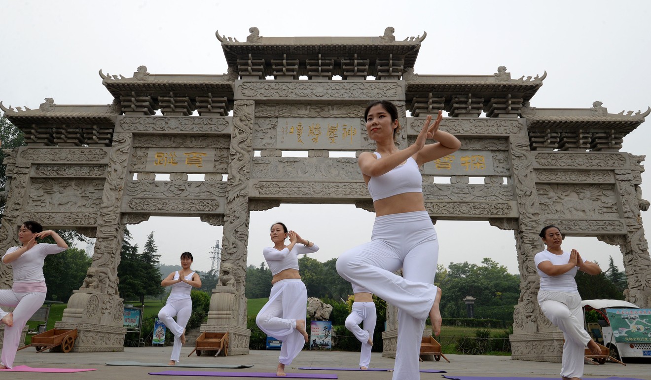 Women practise yoga at a park in China’s Handan. Photo: DPA
