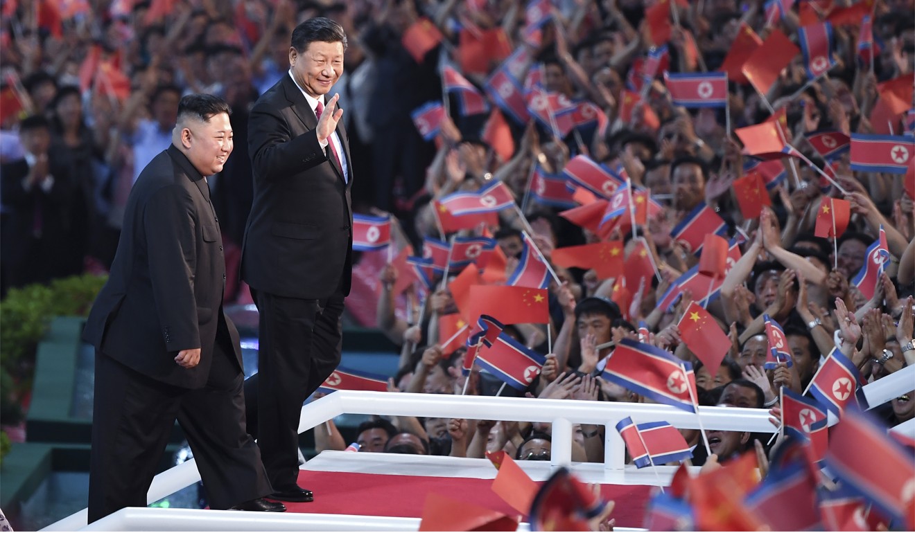 Kim Jong-un and Xi Jinping attend a mass gymnastics and arts performance in Pyongyang on Thursday evening. Photo: Xinhua via AP