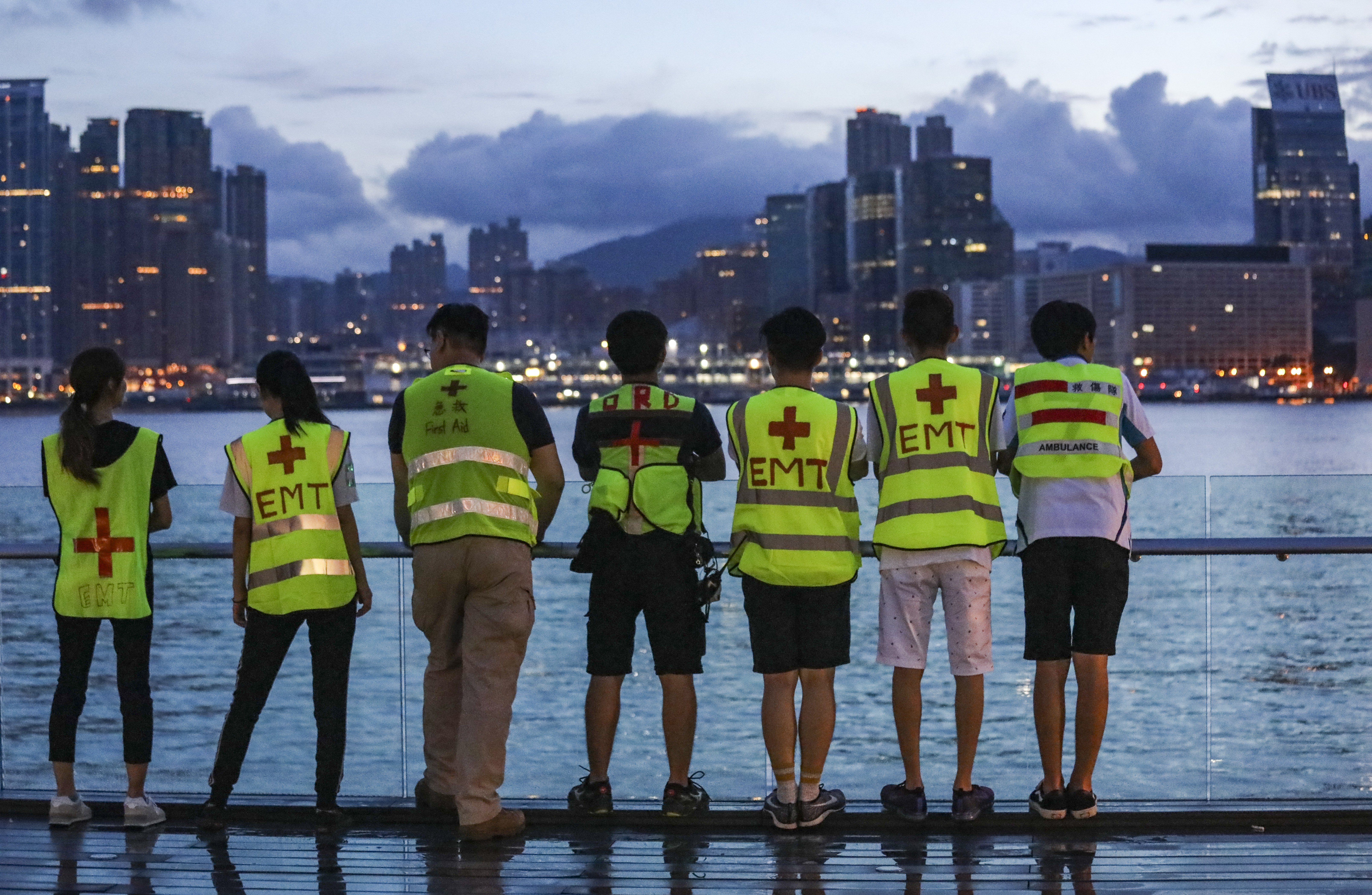 Protesters against the extradition bill take a breather at the harbourfront overlooking the Kowloon skyline outside government headquarters in Tamar, Admiralty, on June 18. The rising cost of housing in Hong Kong has fuelled public dissatisfaction. Photo: Dickson Lee