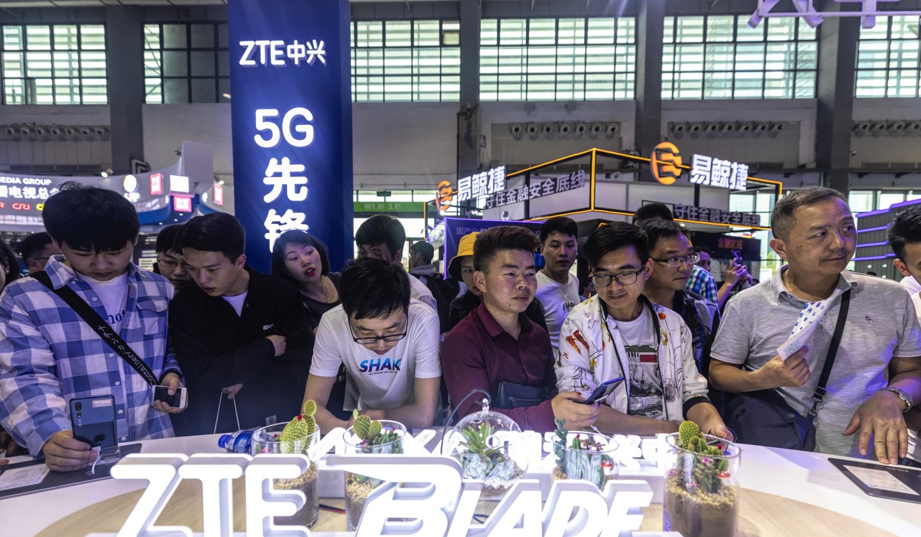 People visit a ZTE booth during Big Data Expo in Guiyang. Photo: EPA-EFE