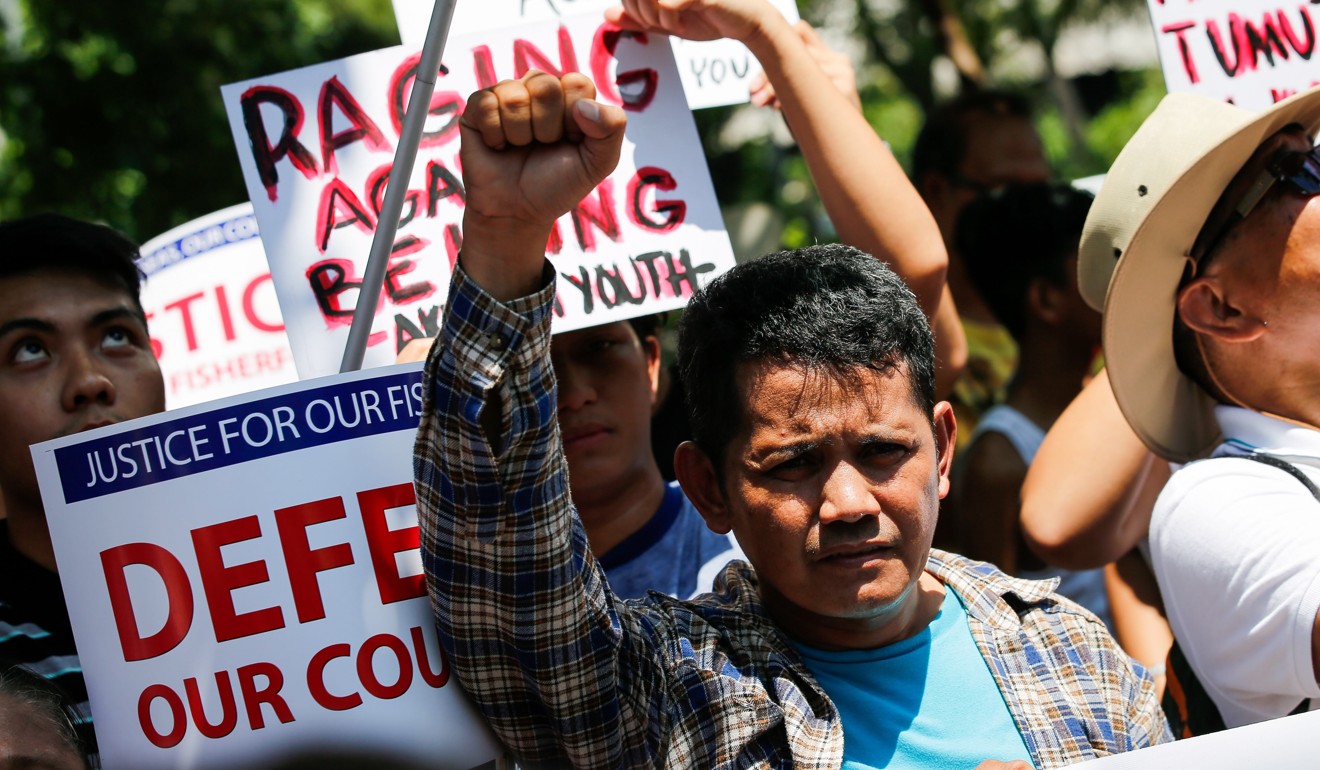Congressman Carlos Zarate accused the government of a cover-up by intimidating and bribing the Filipino fishermen into silence. Photo: EPA-EFE