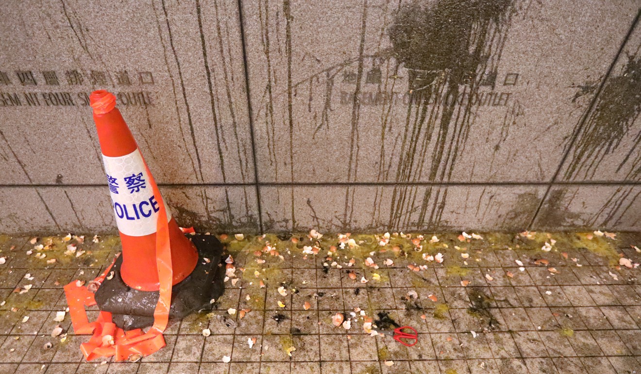 Shattered eggs line the foot of a wall at police headquarters. Photo: Felix Wong