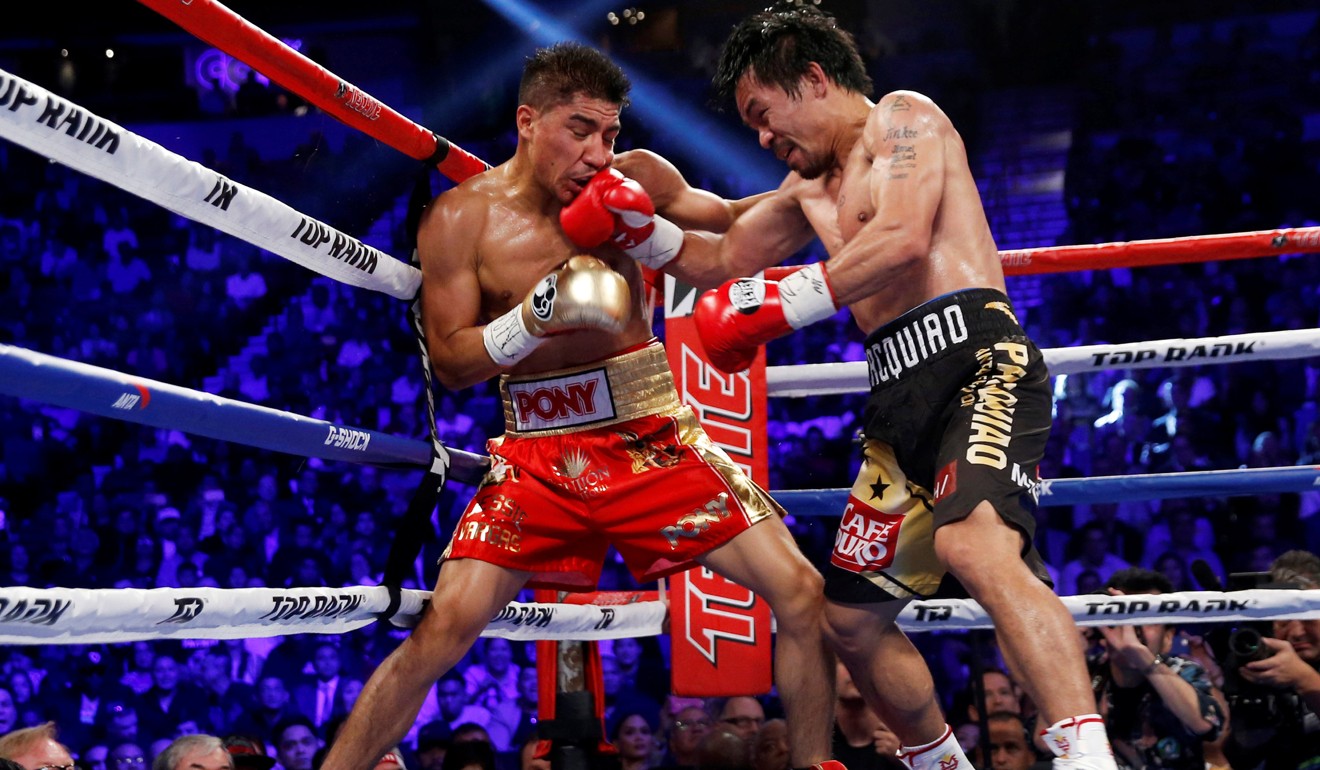 Manny Pacquiao (right) battles Jessie Vargas during their 2016 bout. Photo: Reuters