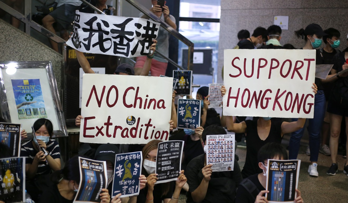 Protesters sits-in at the Immigration Tower in Wan Chai on Friday. Photo: Winson Wong